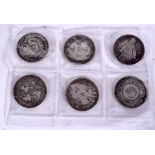 SIX CHINESE WHITE METAL COINS, varying decoration. 3.2 cm wide.