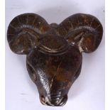 A LARGE EASTERN HARDSTONE PENDANT, formed as a ram head. 16 cm x 16.5 cm.