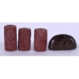 THREE CARVED MIDDLE EASTERN STONE BEADS, together with a seal pendant. (4)
