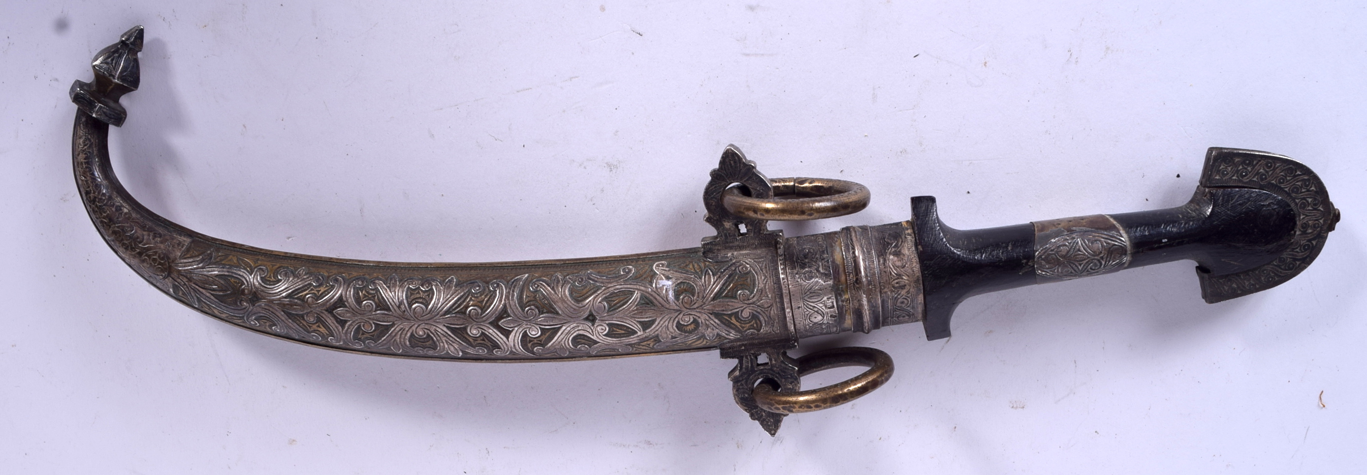 A 19TH CENTURY ISLAMIC KHANJAR CURVED DAGGER, the scabbard inlaid with silver forming foliage. 39 c