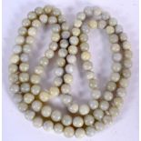 A CHINESE LONG STRAND JADE NECKLACE, formed with spherical beads. 176 cm long.
