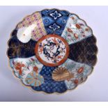 A 18TH CENTURY WORCESTER SCALLOPED PLATE of Old Mosaic type painted with fan panel in Japanese imar