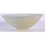 A CHINESE PALE GLAZED PORCELAIN CONICAL SHAPED BOWL, incised with foliage. 20.5 cm wide.