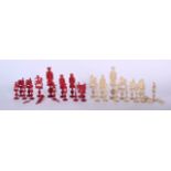 AN EARLY 20TH CENTURY CHINESE IVORY PART CHESS SET, one set stained red. (qty)