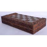 A FINE 19TH CENTURY ANGLO INDIAN CARVED SANDALWOOD AND IVORY FOLDING GAMING BOARD decorated with mo