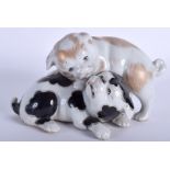 A PAIR OF 19TH CENTURY JAPANESE MEIJI PERIOD PUPPY GROUP modelled in a playful stance. 17 cm x 11 c