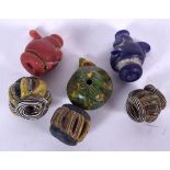 A GROUP OF ANTIQUE GLASS BEADS, varying form. (qty)