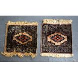 A SMALL PAIR OF TEKKE TURKMEN BEIGE GROUND RUG, decorated with central motif. 36 cm x 29 cm.