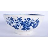 A 18TH CENTURY WORCESTER BOWL with various floral prints and butterflies in blue. 17 cm wide.