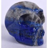 A CARVED LAPIS LAZULI SCULPTURE OF A SKULL, 20th century. 3.75 cm high.