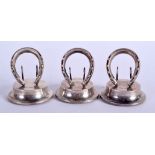 THREE NOVELTY EQUESTRIAN SILVER HORSE SHOE MENU HOLDERS. Birmingham 1906. 2.1 oz. (3)