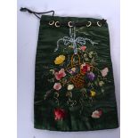 A SILK EMBROIDERED BAG, decorated with flowers in a basket. 31 cm x 20 cm.