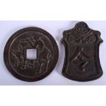 TWO CHINESE BRONZE COINS. 6.5 cm wide, 4.75 cm x 7.5 cm. (2)