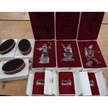 THREE BOXED SWAROVSKI CRYSTAL GLASS MASQUERADE FIGURINES, together with associated plaques and stan