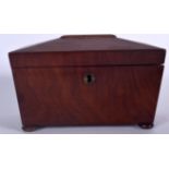 AN EARLY 20TH CENTURY MAHOGANY SARCOPHAGUS SHAPED TWO DIVISION TEA CADDY, formed with bun feet. 21