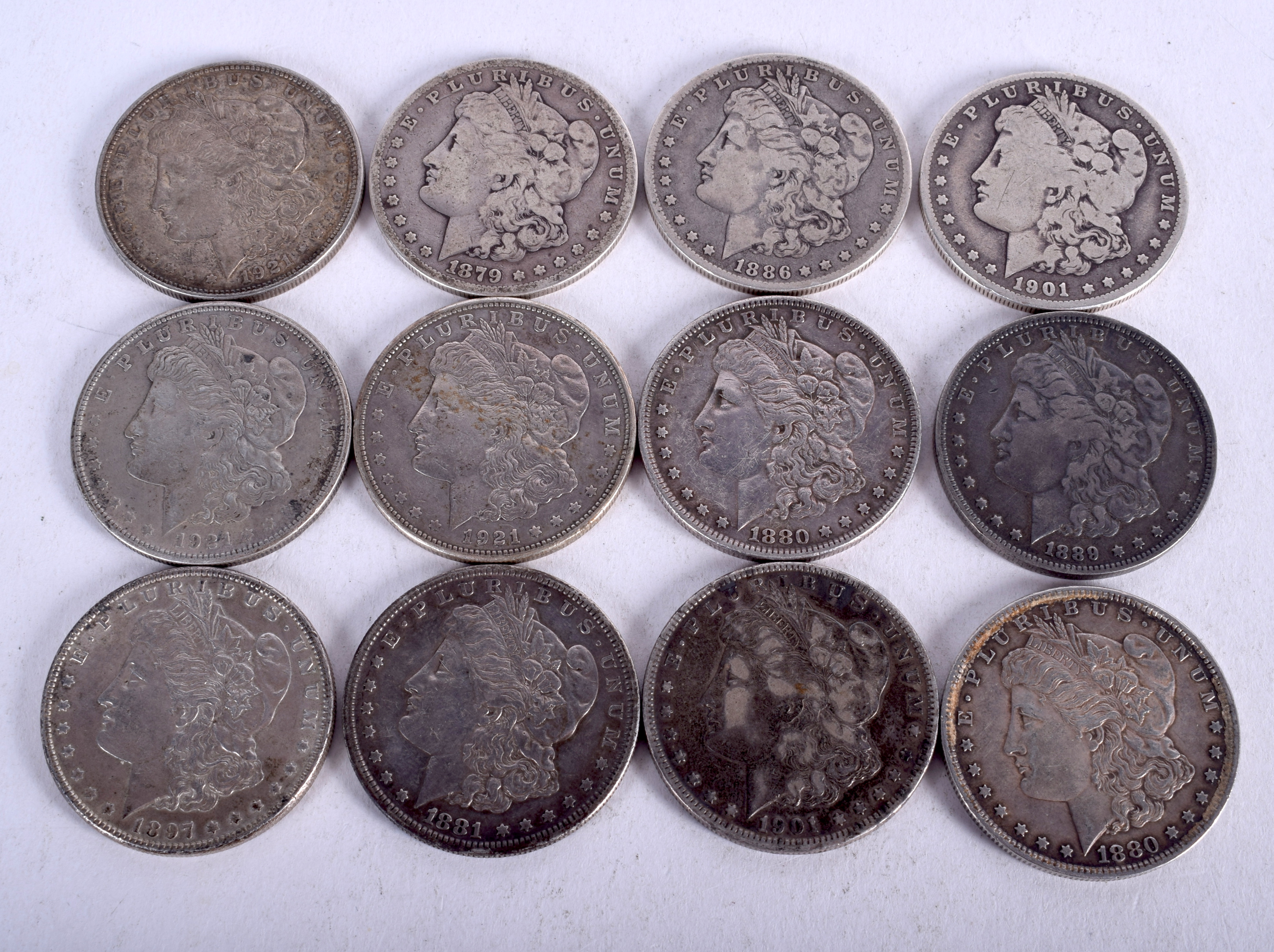 TWELVE VINTAGE SILVER EAGLES Various dates. (12)