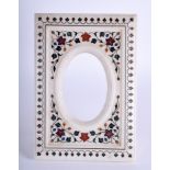 AN EASTERN CARVED MARBLE PICTURE FRAME, inlaid with hardstone foliage. 24.5 cm x 16.5 cm.