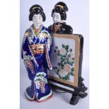 A LARGE 19TH CENTURY JAPANESE MEIJI PERIOD PORCELAIN FIGURE OF TWO GEISHA painted with flowers. 30 c