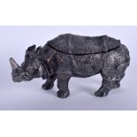 A BRONZE INK WELL IN THE FORM OF A RHINOCEROS, modelled standing. 16.5 cm wide.