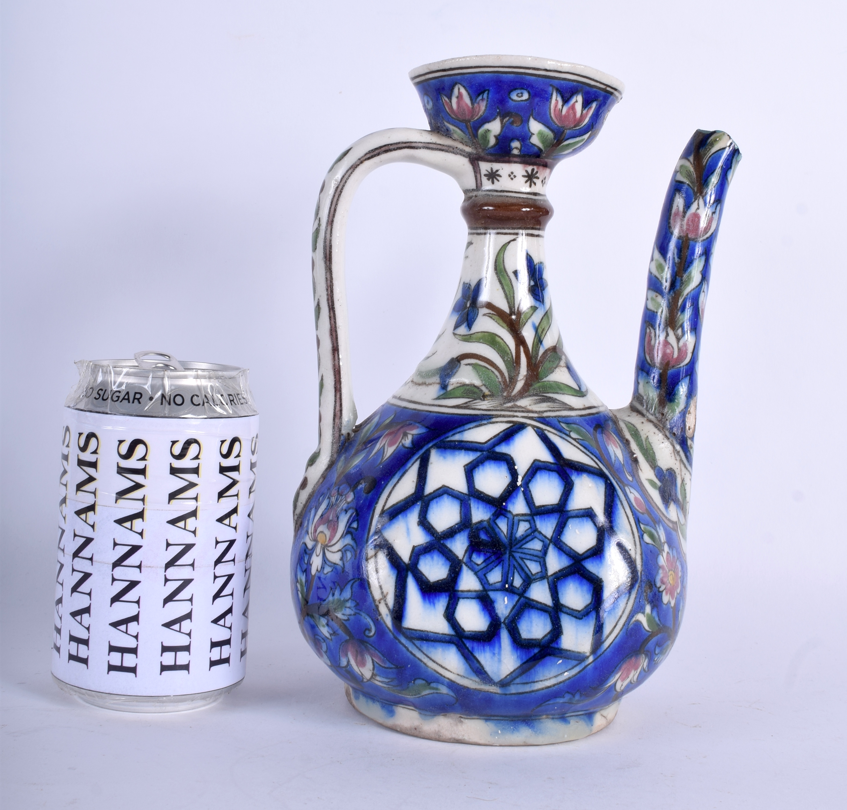 A RARE 19TH CENTURY MIDDLE EASTERN PALESTINE POTTERY EWER painted with flowers and a star motif. 23