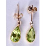 A PAIR OF 9CT GOLD PERIDOT EARRINGS.