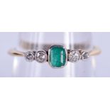 AN 18CT GOLD DIAMOND AND EMERALD RING. 2.4 grams. O.