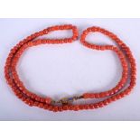 AN 18CT GOLD RED CORAL NECKLACE. 65 grams. 80 cm long.