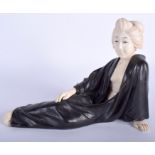 A 19TH CENTURY JAPANESE MEIJI PERIOD BRONZE AND IVORY GEISHA modelled reclining. 25 cm x 18 cm.