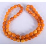 AN ANTIQUE AMBER NECKLACE. 29 grams. 54 cm long.