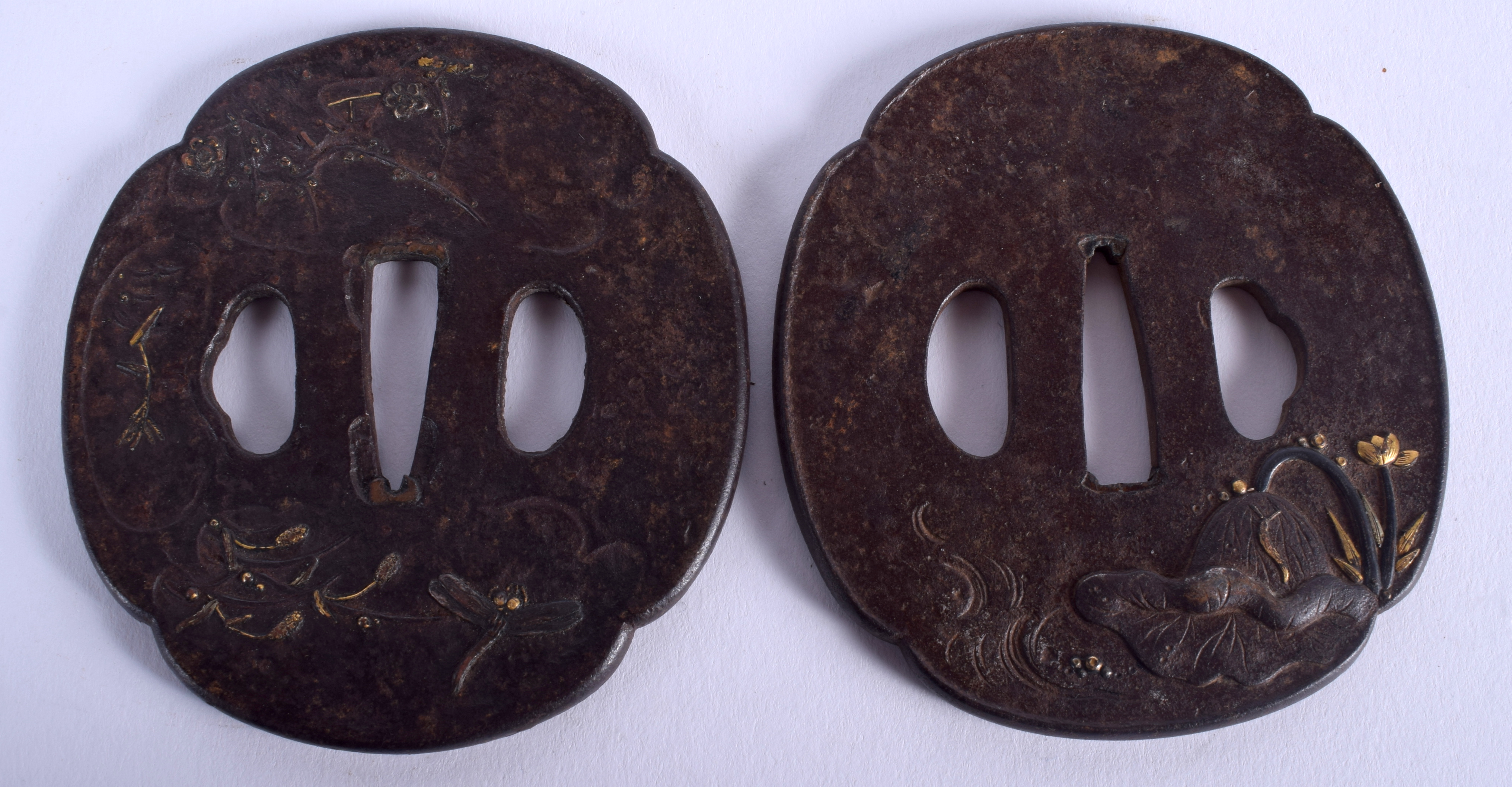 A PAIR OF 18TH/19TH CENTURY JAPANESE EDO PERIOD IRON TSUBA decorated in silver and gold with lotus.