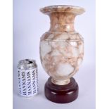 AN 18TH/19TH CENTURY CONTINENTAL CARVED MARBLE VASE Antiquity style, upon a wooden base. 28 cm high.