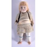 AN UNUSUAL EARLY 20TH CENTURY EUROPEAN PORCELAIN DOLL with original clothing and fully porcelain lim