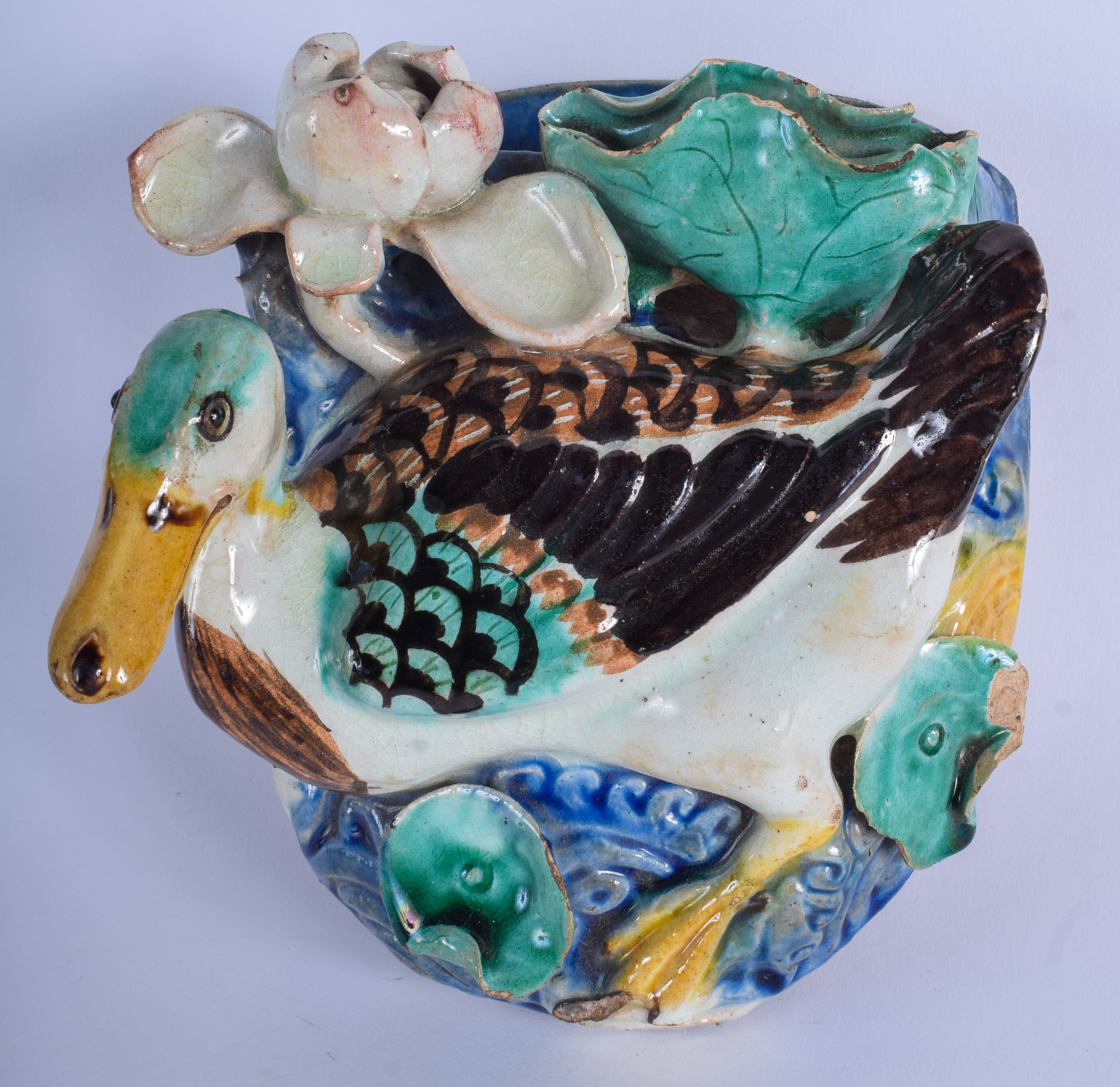 A LATE 19TH CENTURY CHINESE POTTERY WALL POCKET overlaid with a duck amongst lotus. 15 cm x 19 cm.