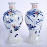 A PAIR OF 18TH CENTURY JAPANESE EDO PERIOD ARITA VASES painted with flowers. 23 cm high.