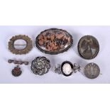A GROUP OF SILVER BROOCHES. (qty)