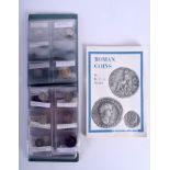 A COLLECTION OF ROMAN COINS together with a Roman coin identification guide. (qty)