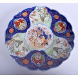 A 19TH CENTURY JAPANESE MEIJI PERIOD IMARI DISH painted with flowers. 27 cm wide.