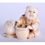 A 19TH CENTURY JAPANESE MEIJI PERIOD CARVED IVORY NETSUKE modelled as a male holding a bowl. 4.5 cm