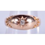 A 18CT GOLD AND DIAMOND RING. 5.7 grams. O/P.