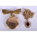 A 9CT GOLD AND RUBY NECKLACE together with a gold locket pendant. 9.6 grams. (2)
