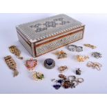 AN ISLAMIC WOODEN JEWELLERY BOX, containing assorted jewellery. Box 7.5 cm x 26 cm.