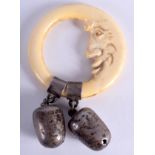 A RARE ANTIQUE SILVER AND IVORY CRESCENT MOON BABIES RATTLE. 6 cm wide.