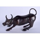 A BRONZE FIGURE OF A BULL, modelled standing. 29 cm wide.