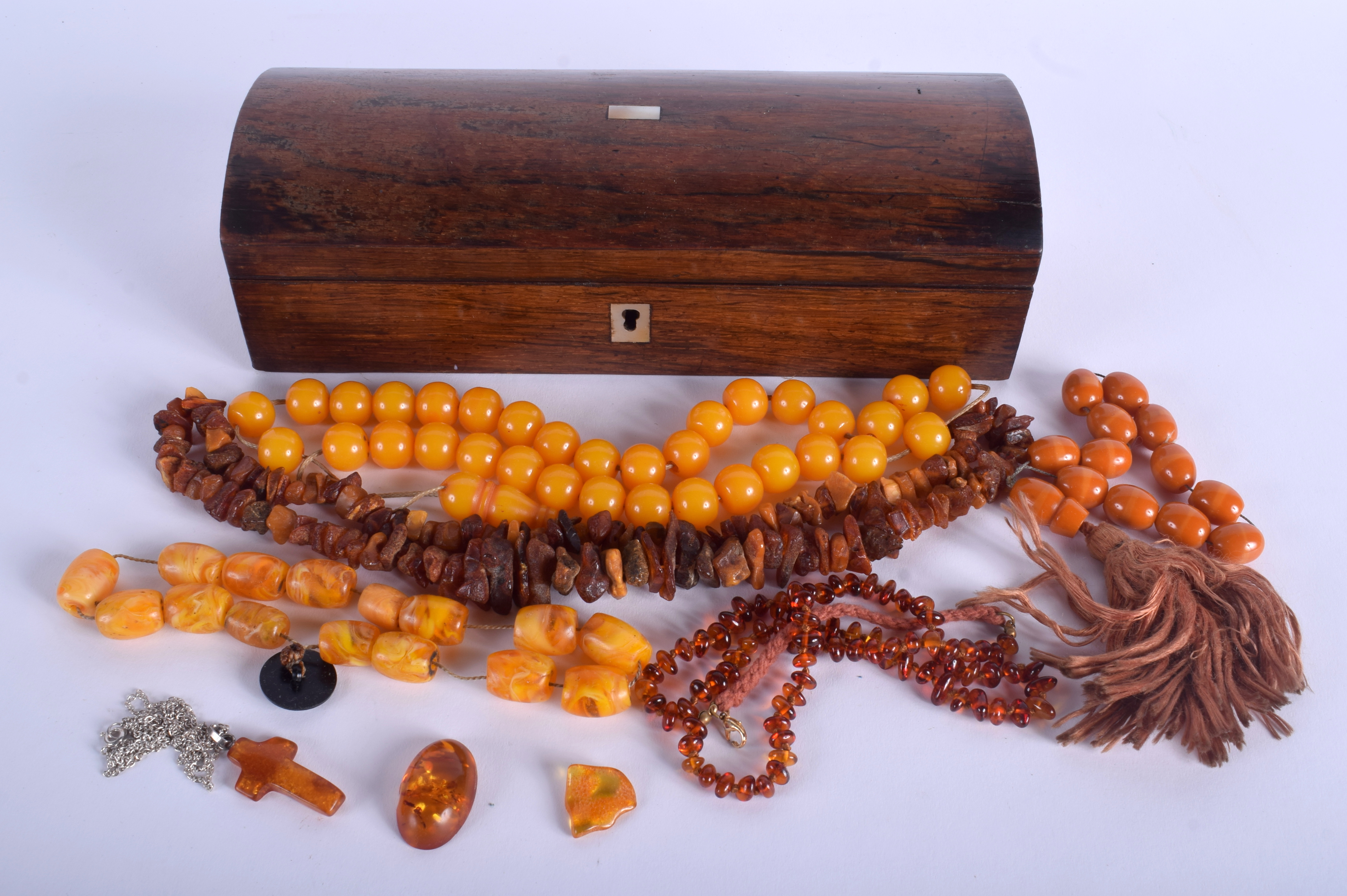 A VICTORIAN BOX together with amber necklaces. (qty)