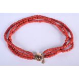 AN 18CT GOLD AND CORAL NECKLACE. 60 grams. Strand 34 cm long.