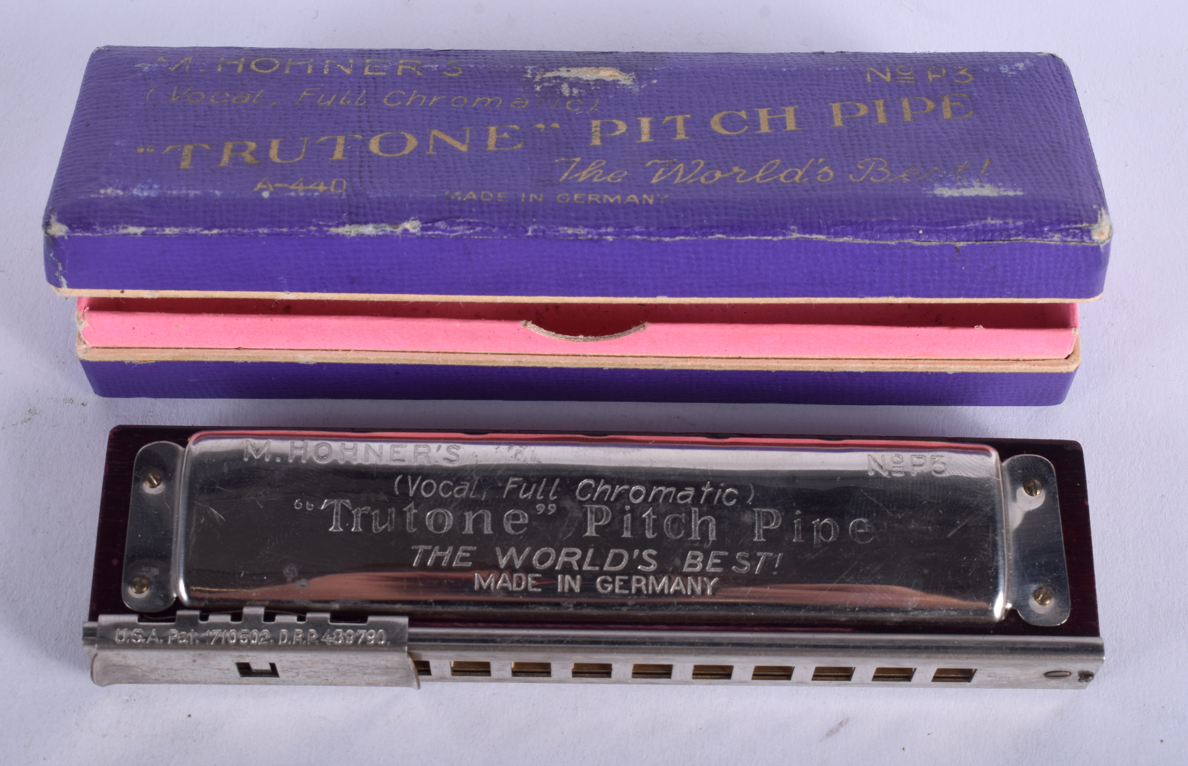 A VINTAGE M HOHNERS TRUTONE GERMAN PITCH PIPE HARMONICA.