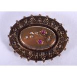 A VICTORIAN 15CT GOLD RUBY AND DIAMOND BROOCH. 9.9 grams. 5 cm x 3.5 cm.