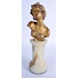 AN ART NOUVEAU GILT BRONZE FIGURE OF A SEMI CLAD FEMALE modelled upon a marble base. 25 cm high.