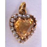 AN ANTIQUE 9CT GOLD CITRINE HEART PENDANT. 1.2 grams.