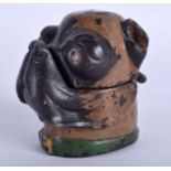 A COLD PAINTED BRONZE INK WELL IN THE FORM OF A DOG, modelled in a green collar. 9.5 cm high.